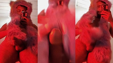 Red fluffy devil with a big uncut cock fills the mirror with cum