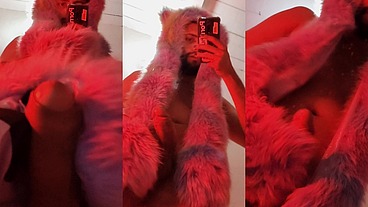 Red fluffy devil with a big uncut cock fills the mirror with cum