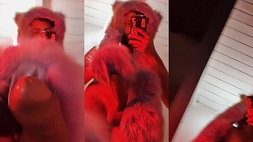Red fluffy devil with a big uncut cock fills the mirror with cum