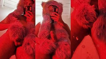 Red fluffy devil with a big uncut cock fills the mirror with cum