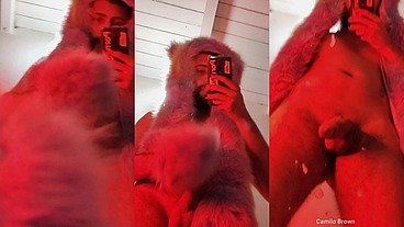 Red fluffy devil with a big uncut cock fills the mirror with cum