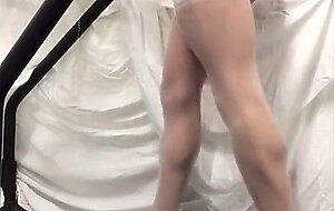 Crossdresser in White Stockings on Treadmill