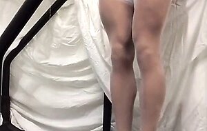 Crossdresser in White Stockings on Treadmill