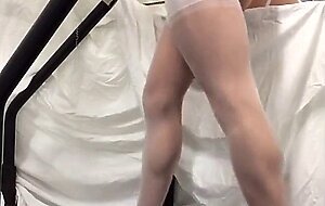 Crossdresser in White Stockings on Treadmill