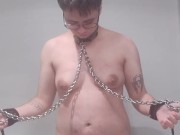 chained slave pisses self