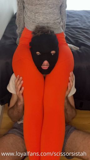 I put my slave on the floor and squeezed him between my thighs (orange leggings)