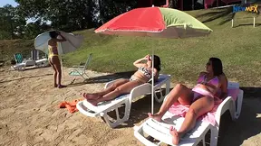 Lesbian girls lick each other's asses at the nude beach
