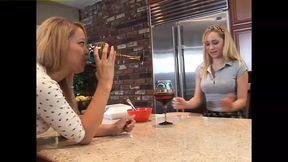 Two blondes explore each other&#039;s bodies in the kitchen