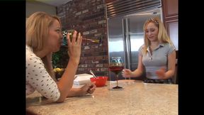 Two blondes explore each other&#039;s bodies in the kitchen