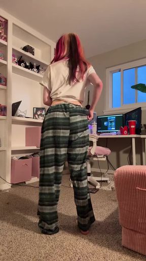 Woman in pajamas standing in living room