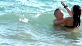 Brunette slut gets fucked doggystyle on the beach