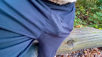 Black hunk walks in woods with big cock bulge flapping