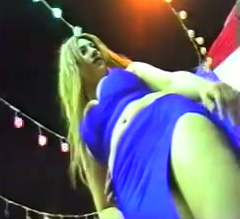 Busty Arab belly dancer in hot blue dress in the nightclub