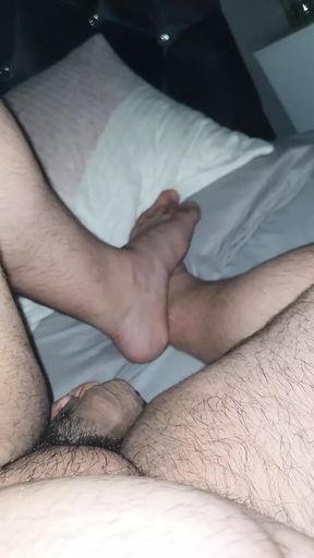 Step mom hand goes under step son leg touching his cock