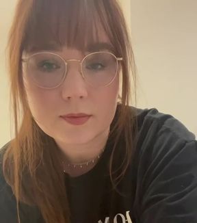 Woman in glasses with red hair