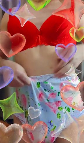 a crossdresser tries on large floral cotton pants