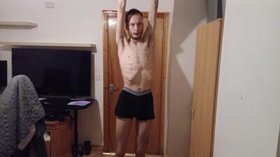 Super skinny bearded lad puts on multiple underwear and shows his tiny ass