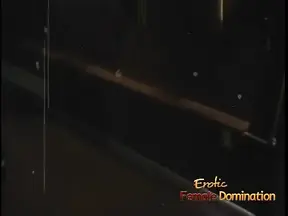 Blonde domatrix punishes masked submissive in an erotic femdom scene
