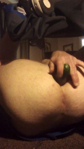 Cucumber inserted hard in guys ass