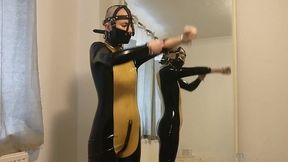 putting on my muzzle and latex catsuit.