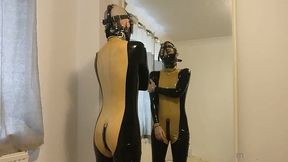 putting on my muzzle and latex catsuit.