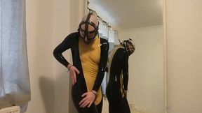 putting on my muzzle and latex catsuit.