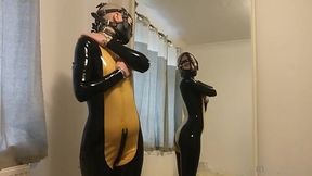 putting on my muzzle and latex catsuit.