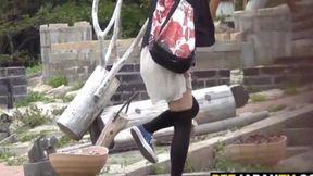 Japanese girl urinates outside in front of crowd
