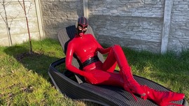 Latex doll sunbathing