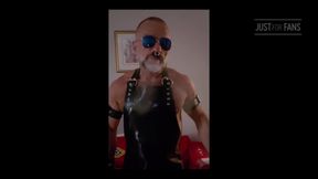 Stepdad lighting his Cigar in rubber apron
