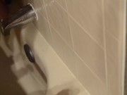 Shaved twink practices deepthroating in the shower