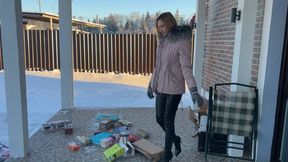 girl in high-heeled boots crushes cardboard and boxes and enjoys it