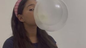 POV you see a cute girl blowing big bubbles