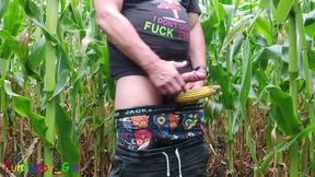 A sexy guy pisses in a cornfield, jerks off his thick cock and engages in other kinky play.