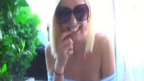 This sexy blonde is not shy about giving me a peek up her skirt in public