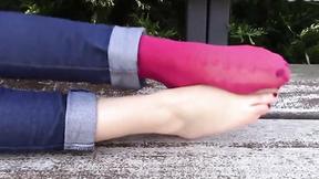 ”Warm stunning sexy girl Diana rests on a bench in a really jampacked park, with her pink socks on. She chooses to”