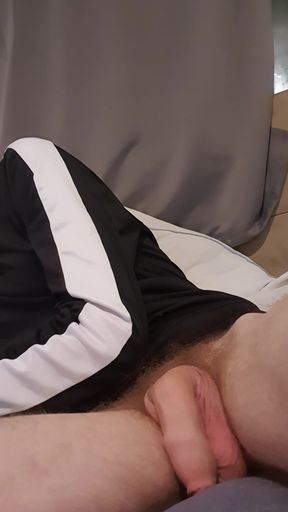 Young horny lad close-up of massive uncut cock
