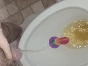 Sean pisses on then rides a pride cock