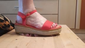 Stomping face in red sandals and barefoot (facebox)