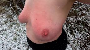 Slapping her tits while hiking through the snow