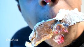 Eating cake with his mouth