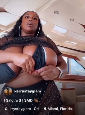 Ebony babe shows off her huge bust in a maserati