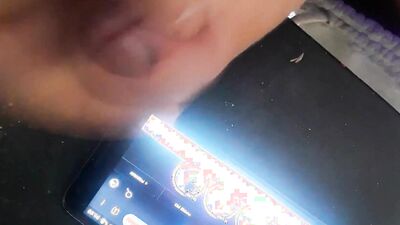 Horny guy watches gay porn on his phone and jerks off