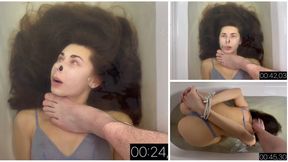 Practicing holding her breath underwater face up and face down (custom video)