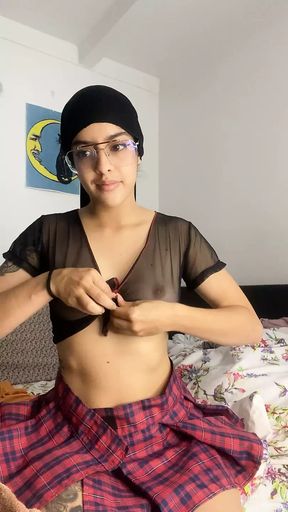 Arab woman in hijab performs a sensual striptease leaving her breasts in the air