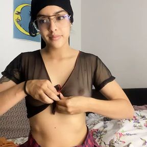 Arab woman in hijab performs a sensual striptease leaving her breasts in the air