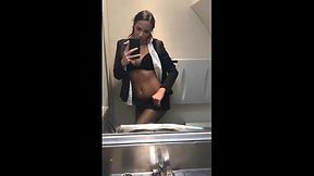 Incredible flight attendant posing nude in plane toilet and rubs her wet pussy