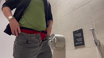 Pissing at the Mall Bathroom before meeting his Jordanian friend