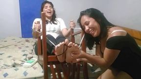 Graciela has a lot of fun tickling Amelia's feet