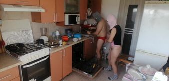 Couple Having Fun in the Kitchen. Sexy Wife Doing Chores in the House Naked